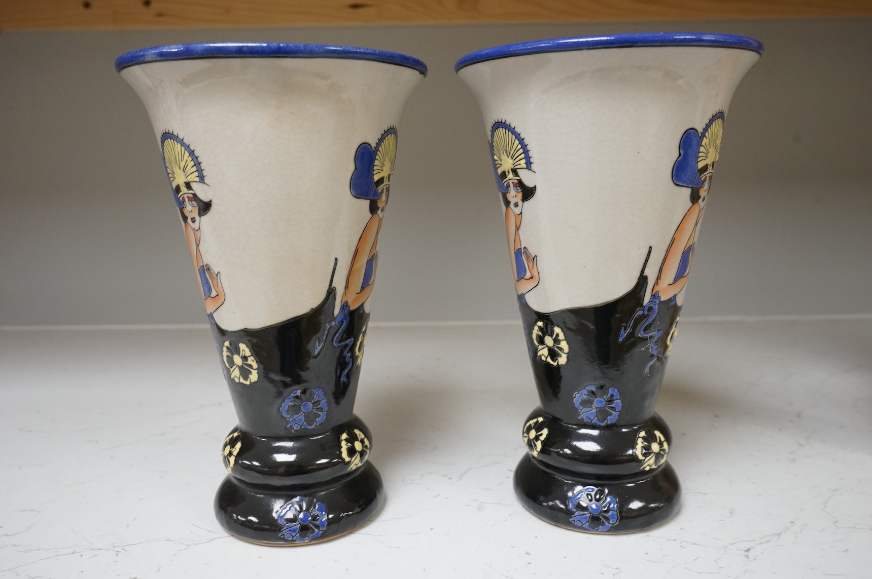 A pair of Longwy style 'flapper lady' pottery vases